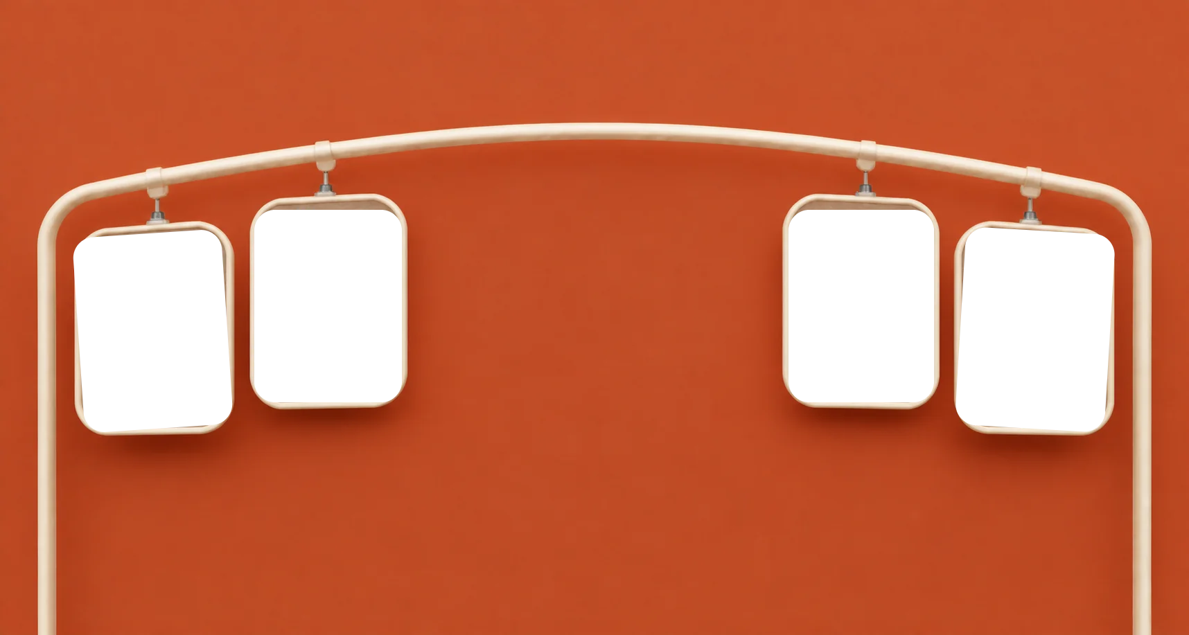 Four matching garment frames hanging from a curved cream wardrobe rail
